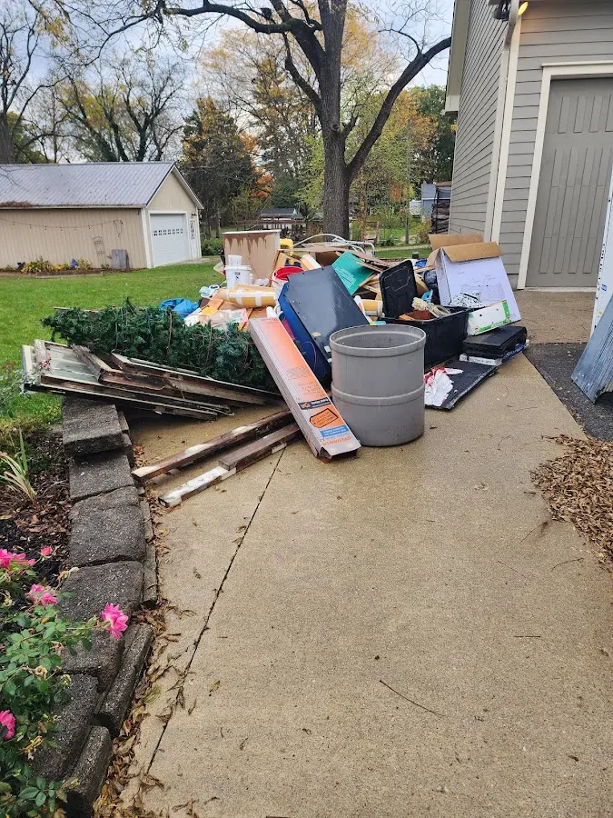 Dumpster being loaded with debris for 10 Yard Dumpster Rental in Galloway